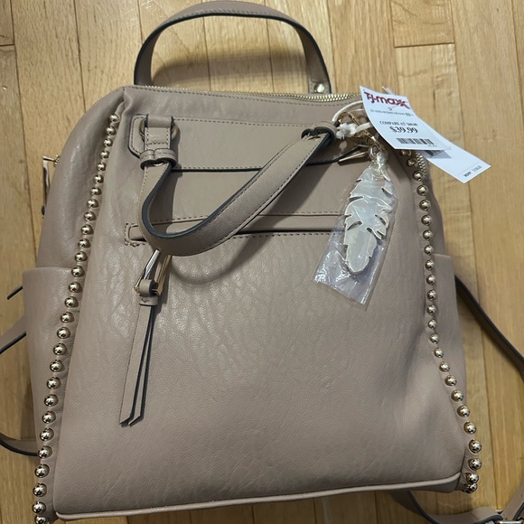 Jessica Simpson Handbags - Jessica Simpson Beige Backpack with Gold Studs